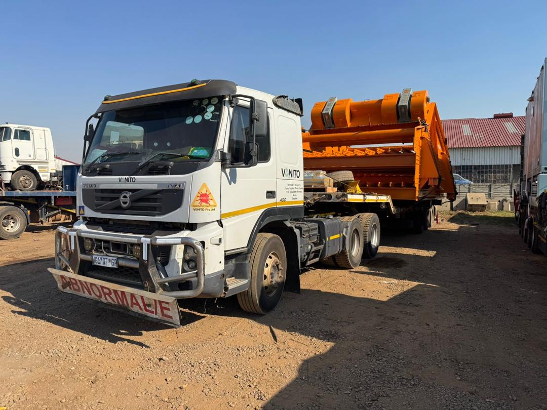 Truck carrying oversized industrial equipment marked as an abnormal load