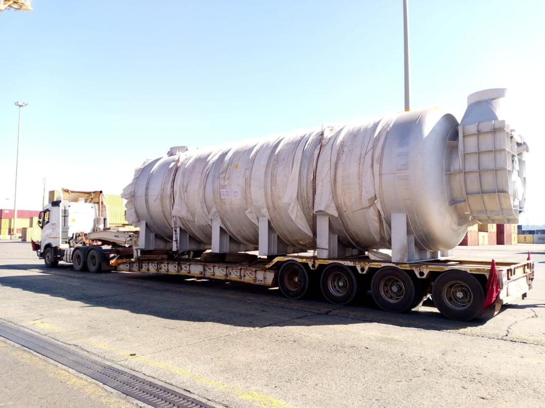 Large industrial vessel transported on a multi-axle trailer